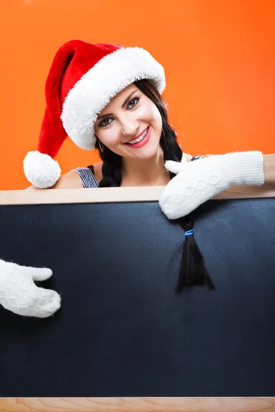 Cheerful girl posing with blackboard — Stock Photo, Image