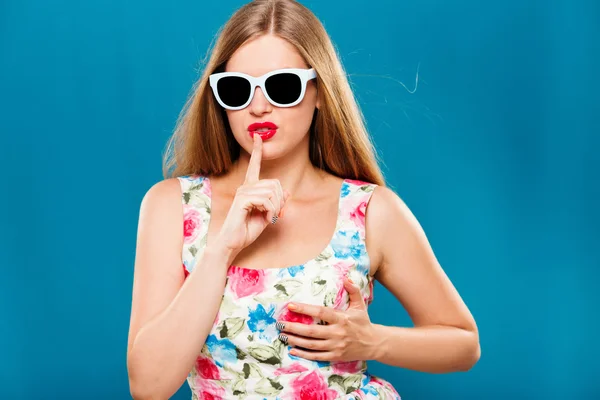 Woman posing with finger near her lips — Stok fotoğraf