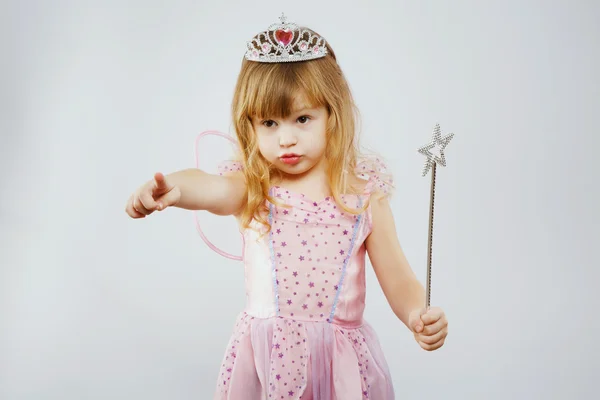 Charming girl posing with magic stick — Stock Fotó
