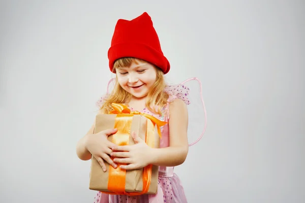 Charming girl, looking on present — Stock Photo, Image