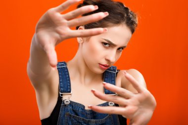 Pretty girl posing with raised hands