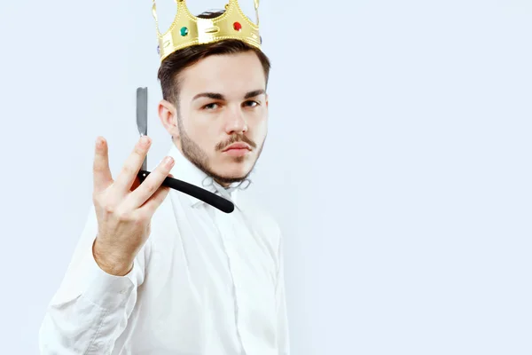 Handsome barber posing with razor — Stock Photo, Image