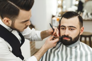 Barber making a beard clipart
