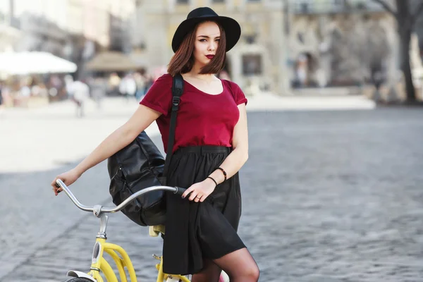 Beautiful girl with bicycle — Stock Photo, Image