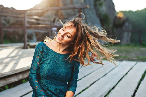 Smiling girl with fluttering hair