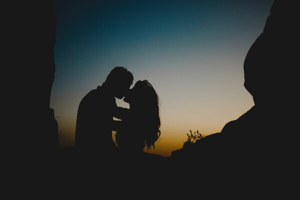 Kissing couple in twilight