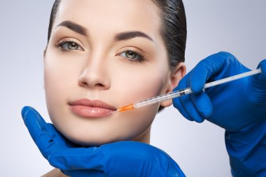Young lady operated by plastic surgeon