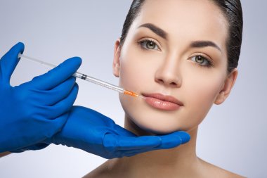 Young woman having plastic operation