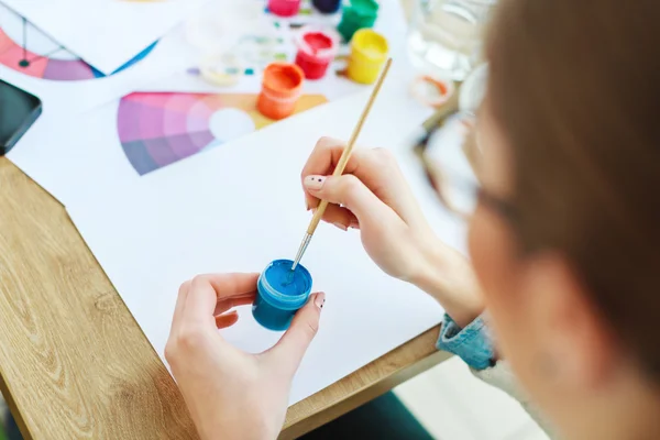 Woman's hands with white manicure drawing — 스톡 사진