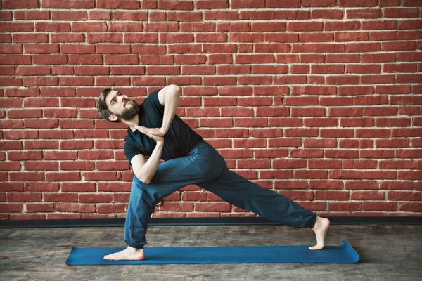 Yoga positions at wall background