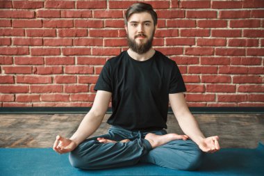 Yoga positions at wall background
