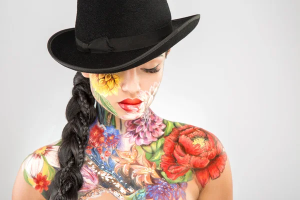 Body art model at gray background — Stock Photo, Image