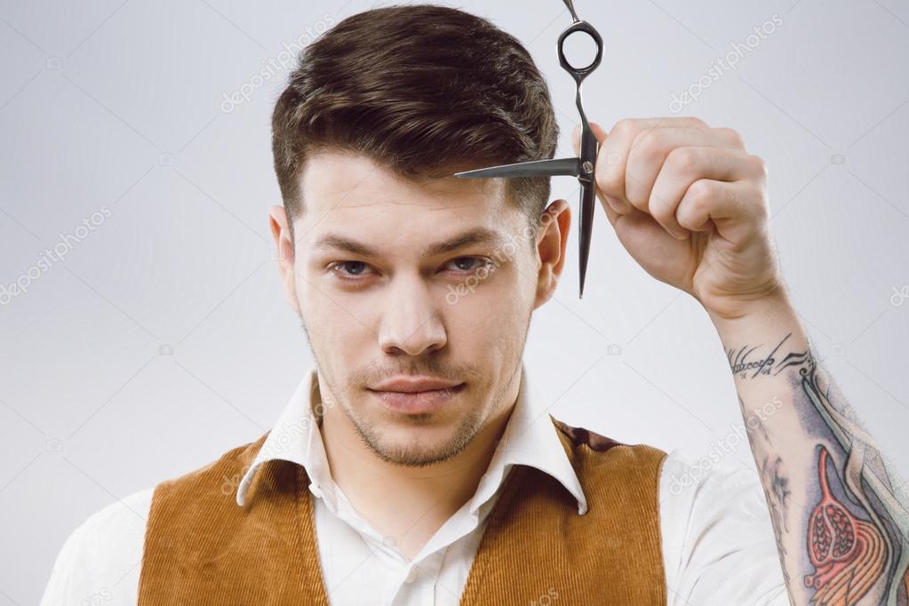 Attractive barber with scissors