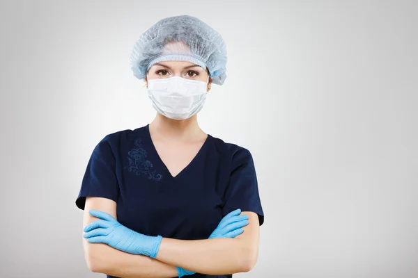 Hermosa enfermera en uniforme médico azul — Foto de Stock