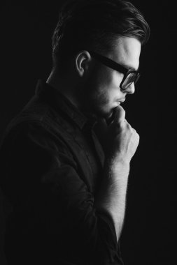Attractive brunette man on black shirt and glasses