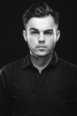 Portrait of handsome young man with beard and dark hair