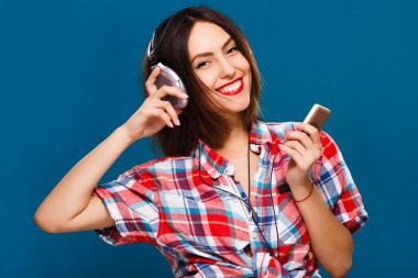 Smiling woman posing with headphones