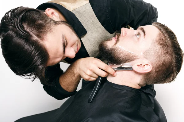 Young barber and customer — Stock Photo, Image