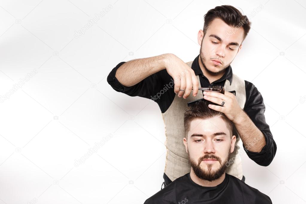 Young barber and customer