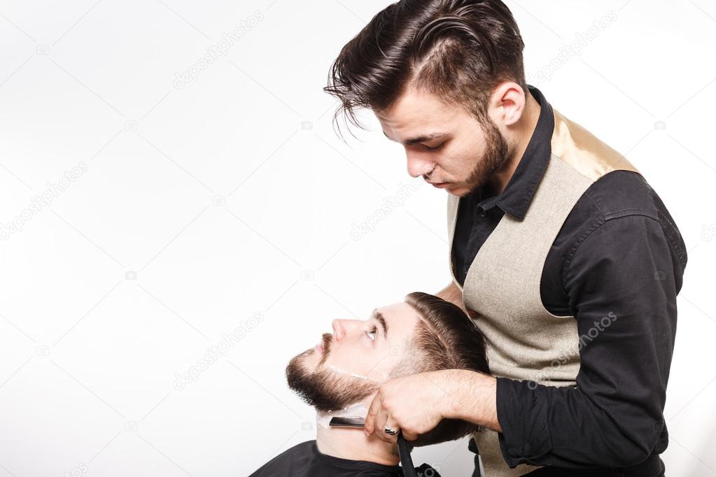 Young barber and customer