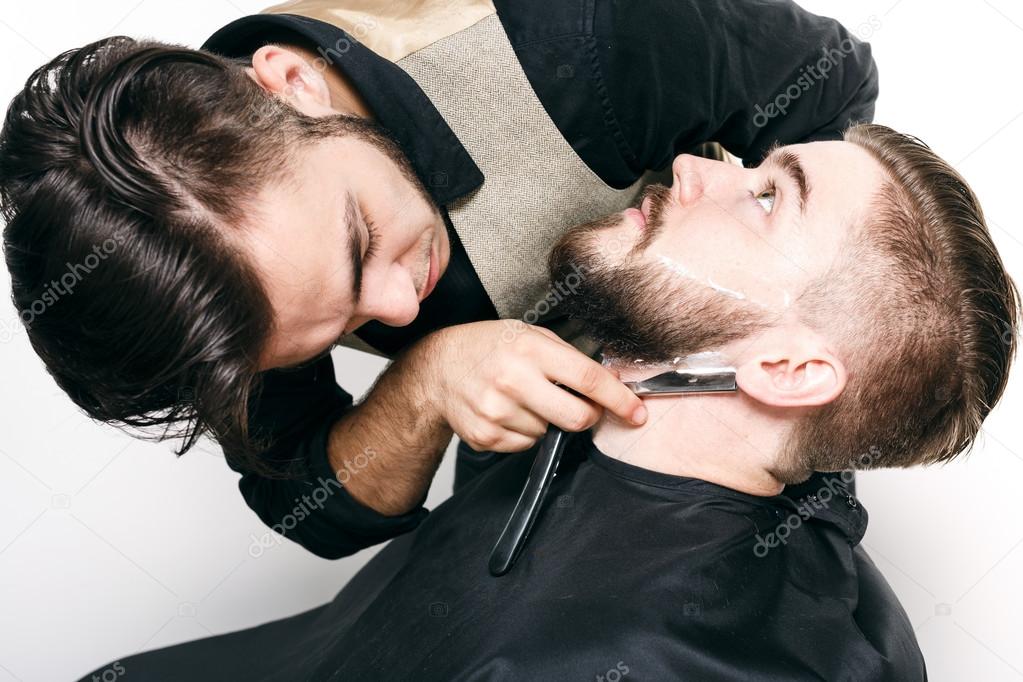 Young barber and customer