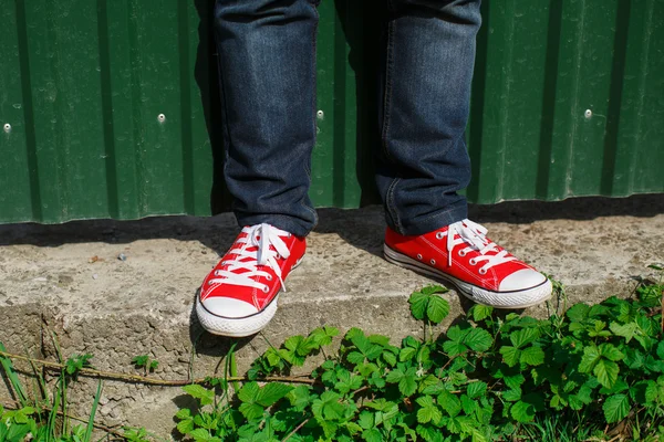 Red shoes on concrete — Stock Photo, Image