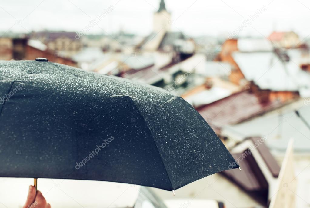 Hand holding an umbrella