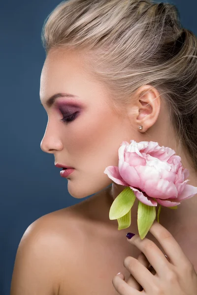 Woman holding peony flower Stock Picture