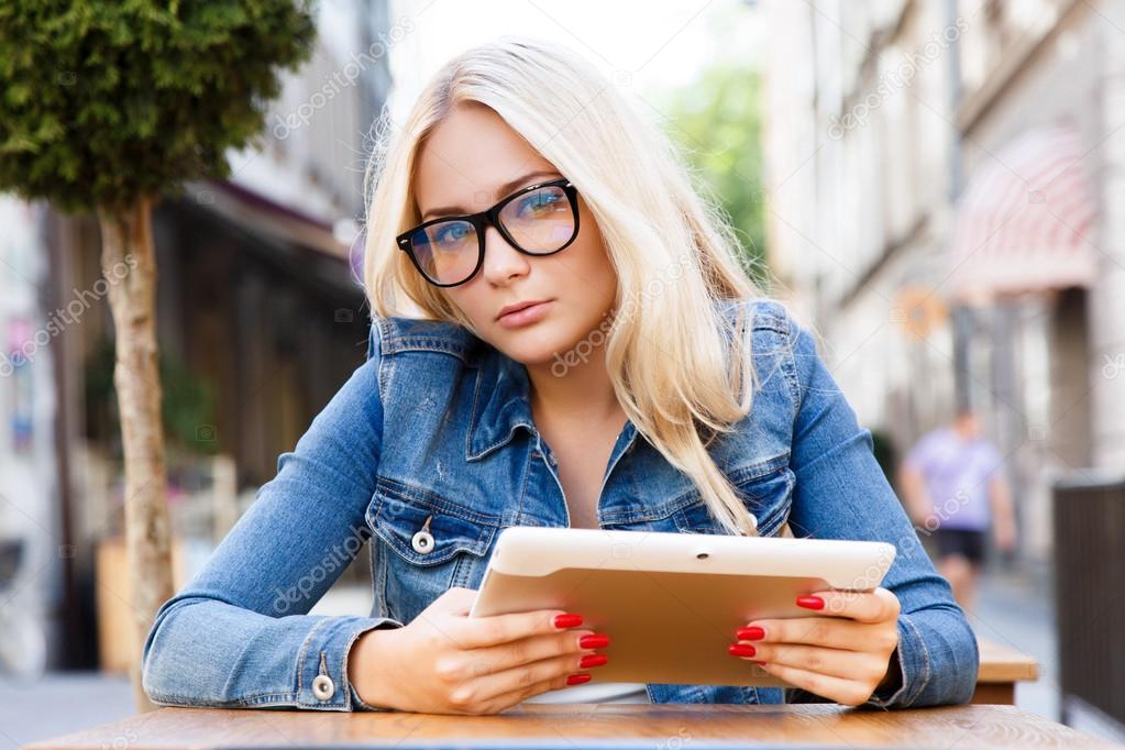 Lovely girl posing with digital tablet