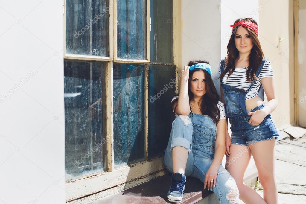 girls wearing vintage overalls and bandanas