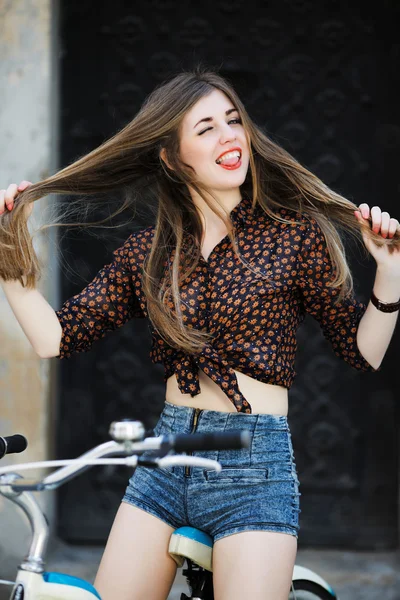 Attractive young girl with bicycle