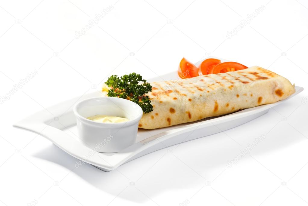 Shawarma on a plate and saucer