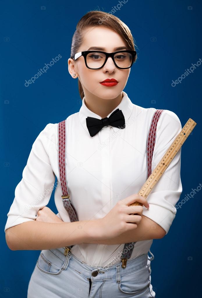 Beautiful girl with ruler Stock Photo by ©VelesStudio 93727134