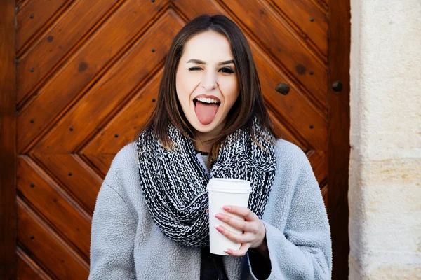 Girl posing with cup of coffee — Stock Photo, Image