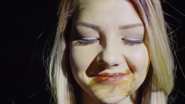 Projections of coins on female face — Stock Video