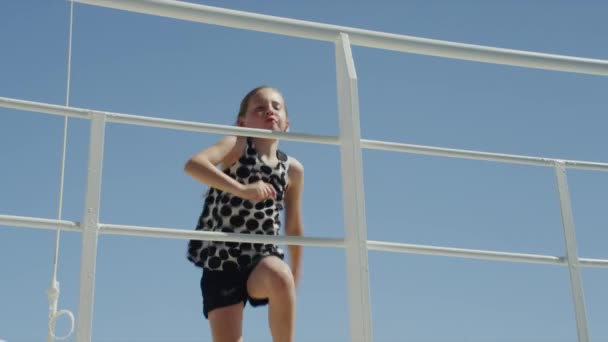 Girl dancing on ship deck — Stock Video