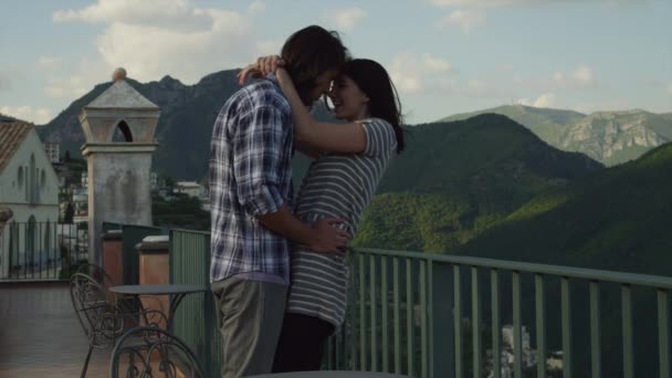 Couple embracing on balcony — Stock Video