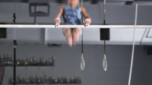 Girl exercising on uneven bars — Stock Video