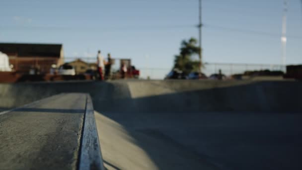 Skateboarder's legs jumping and sliding ramp — Stock Video