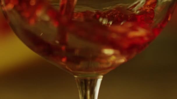 Red wine pouring into wine glass — Stock Video