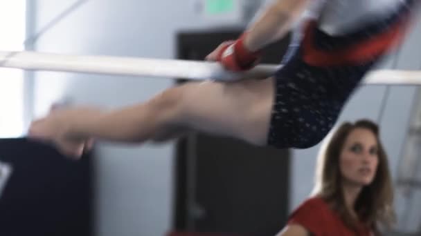 Girl exercising on uneven bar — Stock Video