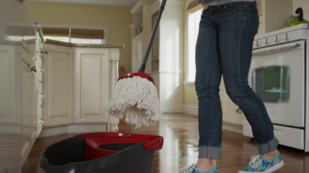 Woman mopping kitchen floor — Stock Video