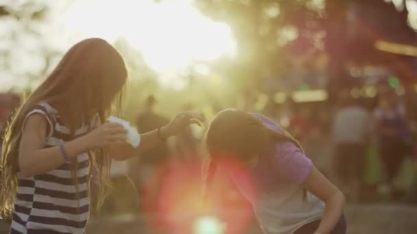 Girls playing with cotton candies — Stock Video