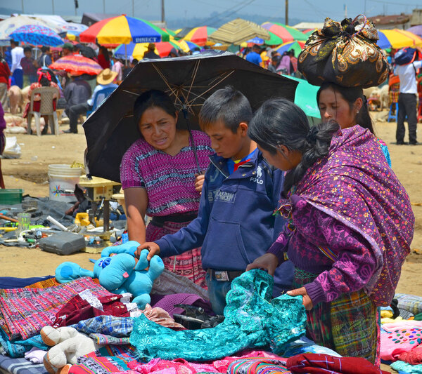 QUETZALTENANGO GUATEMALA  april 28 2016 : People sale clothings in  Quetzaltenango maket. This native market is the most colorful in Central America