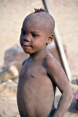 SWAKOPMUND, NAMIBIA OCTOBER 09, 2014: Unidentified child from Himba tribe. The Himba are indigenous peoples living in northern Namibia, in the Kunene region of South-West Africa on october 09 2014