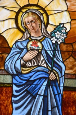 CHARLOTTE NC 06 24 2016: Stained glass window of St. Peter is the oldest Roman Catholic Church in Charlotte. It was established in 1851. Until 1940 it was the only Catholic church in the city. 