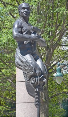 CHARLOTTE NORTH CAROLINA 06 22 2016.Transportation: Here, an African American man represents the builders of the very first railroads in Charlotte. sculpted by Raymond Kaskey in Washington, D.C.