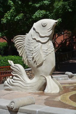 CHARLOTTE NORTH CAROLINA 06 22 2016. Giant Fish Fountain of Big Spitting Fish. A water fountain with three big fish squirts water during warm months.