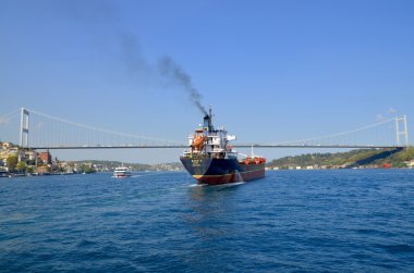 ISTANBUL TURKEY OCT. 4: The ship M V EREN C is a General cargo vessel registered in Panama  in front the Bosphorus bridge on october 4 2013 in Istanbul Turkey
