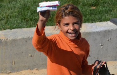 ISTANBUL, TURKEY OCTOBER 6: An unidentified little girl sell paper tissue for help to live on oct, 6 2013. Turkeys child poverty rate of 24.6 percent.